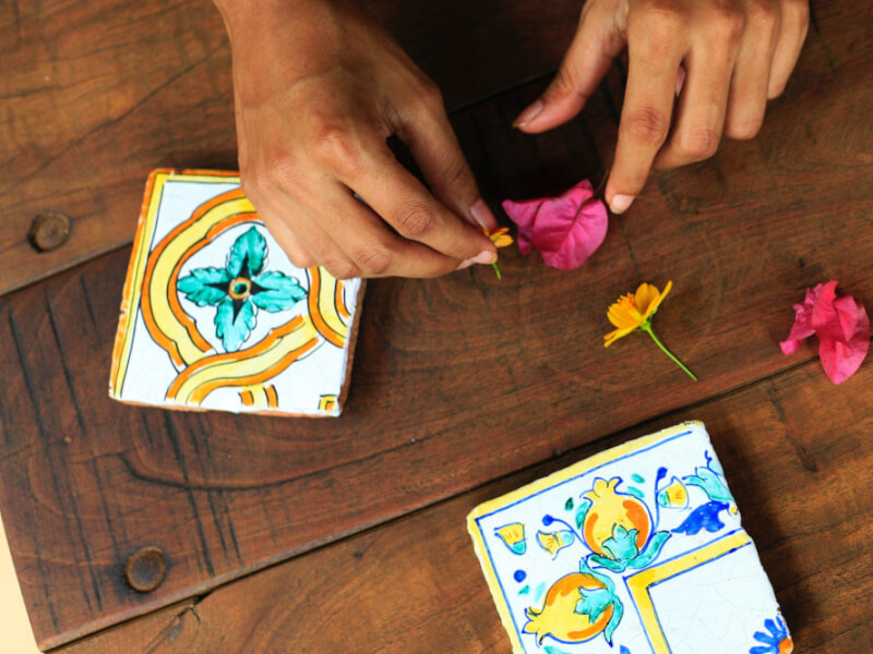 hands preparing to make a mosaic